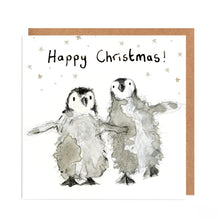 Load image into Gallery viewer, Square white Christmas card featuring watercolour and pencil illustration of a two fluffy baby penguins surrounded by stars, and handwritten &#39;Happy Christmas!&#39; message.