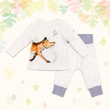 Load image into Gallery viewer, Baby gift set comprising a white top featuring a wraparound illustrated fox print and matching bottoms with purple cuffs, on a backdrop of pastel leaves. 