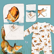 Load image into Gallery viewer, Dexter fox themed baby gift hamper containing a fox print hooded blanket, a fox babygrow, a matching fox card and dribble cloths. They are laid out on a blue background with illustrated Dexter fox stretching below. 