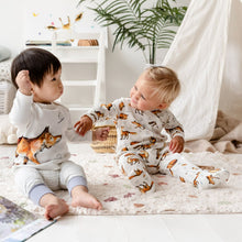 Load image into Gallery viewer, Two toddlers sat beside eachother wearing the Dexter Fox collection. A dark haired toddler is wearing the Dexter fox wraparound top with matching joggers in dusky heather, while a blonde toddler is wearing the Dexter Fox repeat print babygrow. 