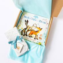 Load image into Gallery viewer, Natural cardboard giftbox with turquoise tissue paper wrapping a gift bundle with the book &#39;Molly, Olive and Dexter&#39; and matching dribble cloths.