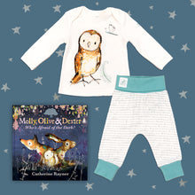 Load image into Gallery viewer, Baby gift set featuring a book from the Molly, Olive and Dexter series by Catherine Rayner, &#39;Who&#39;s Afraid of the Dark?&#39;, and a matching owl pyjama set laid on a midnight blue backdrop with silver stars. The pyjama set comprises a white long-sleeved top featuring an illustrated wraparound owl print and matching bottoms with blue cuffs.