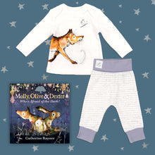 Load image into Gallery viewer, Baby gift set featuring a book from the Molly, Olive and Dexter series by Catherine Rayner, &#39;Who&#39;s Afraid of the Dark?&#39;, and a matching fox pyjama set laid on a midnight blue backdrop with silver stars. The pyjama set comprises a white long-sleeved top featuring an illustrated wraparound fox print and matching bottoms with purple cuffs.