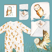 Load image into Gallery viewer, Olive Owl baby gift hamper containing a Olive Owl print hooded blanket, an owl babygrow, a matching owlcard and dribble cloths. They are laid out on a blue background with illustrated Olive Owl flying below. 