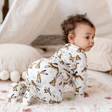 Load image into Gallery viewer, One year old baby girl with curly hair crawling wearing the Molly Hare repeat print babygrow. 