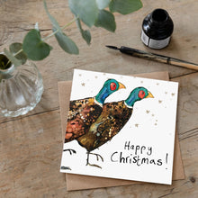 Load image into Gallery viewer, Christmas card featuring illustration of a pair of pheasants laid flat on a wooden table with a matching brown envelope. 