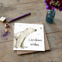 Load image into Gallery viewer, Christmas card featuring illustration of Paddy Polar Bear laid flat on a wooden table with a matching brown envelope. 