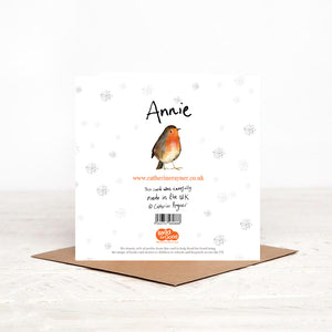 Square robin christmas card stood on matching brown craft envelope, showing reverse side including details about charity partner Read for Good