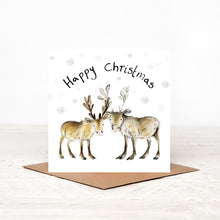 Load image into Gallery viewer, Square illustrated baby reindeer christmas card stood on matching brown craft envelope. 