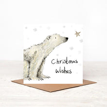 Load image into Gallery viewer, Square illustrated polar bear Christmas card stood on matching brown craft envelope. 